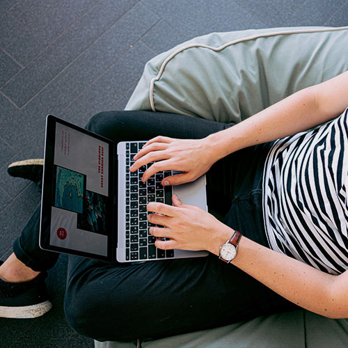 person typing on laptop