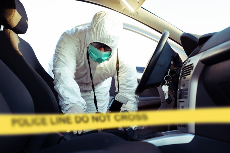 forensic scientist collecting evidence 