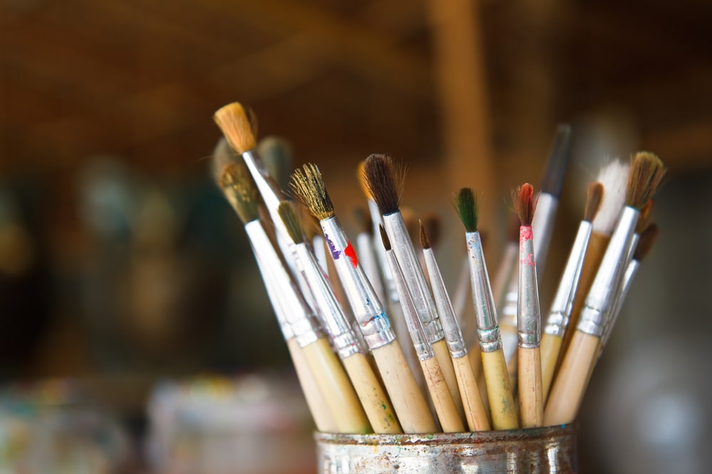 online writing mfa paint brushes in container