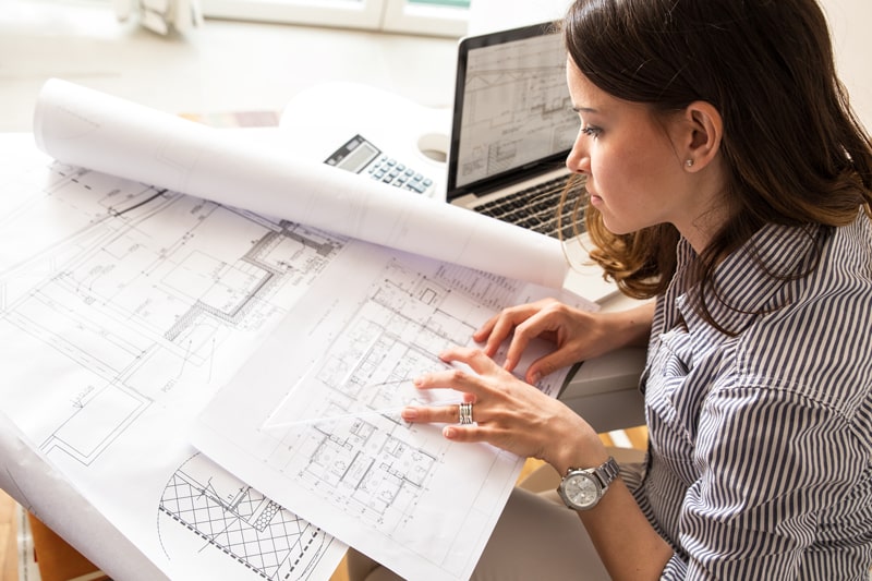 woman looking at interior design plans