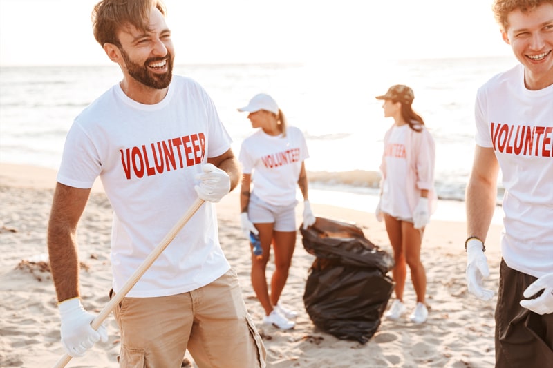 Volunteers picking up litter from the beach.