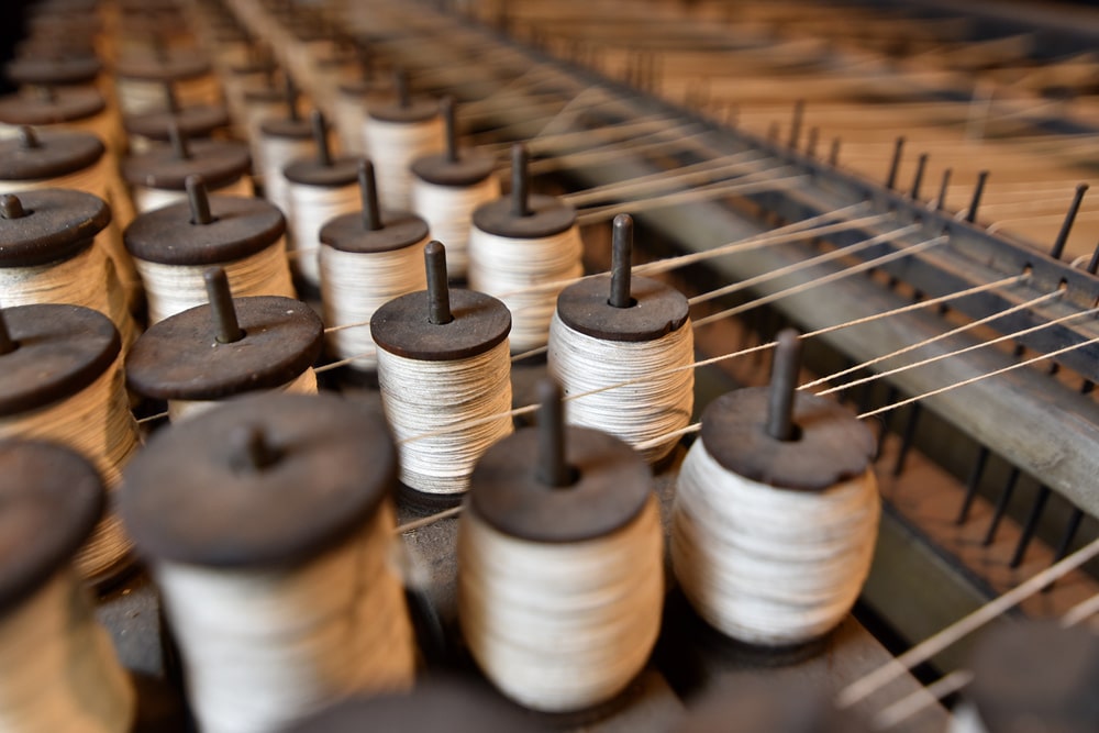 rolls of thread on machine